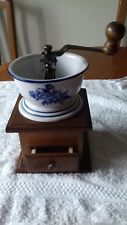 coffee grinder with wooden base and china bowl
